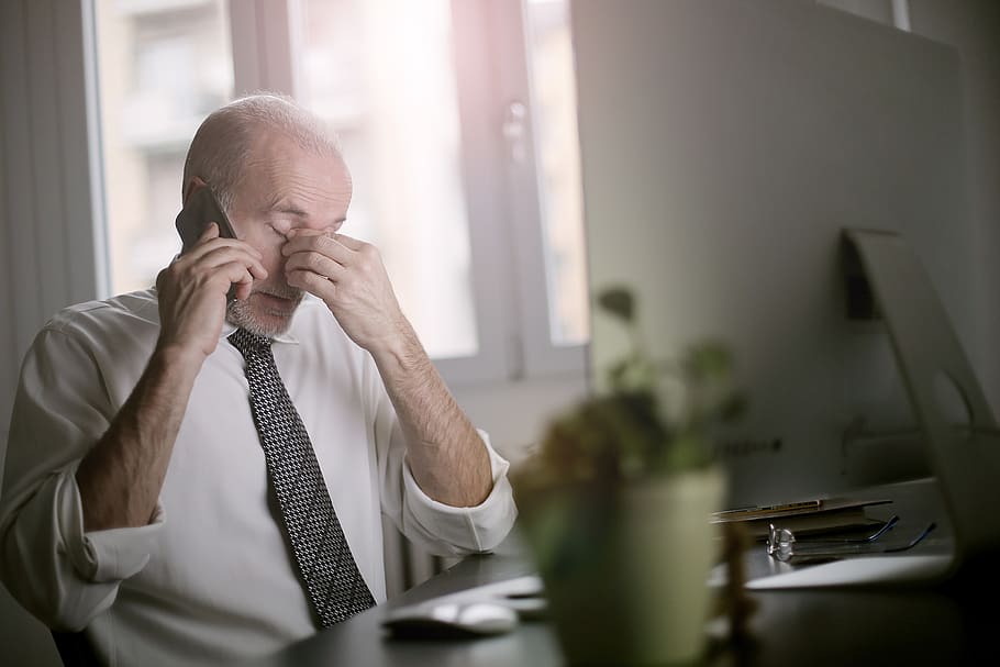 man-using-smartphone-while-sitting-at-the-table.jpg